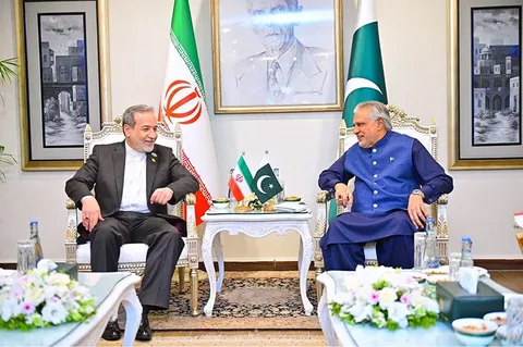 Ishaq Dar and Abbas Araghchi shake hands at the SCO Summit 2026 in Bishkek