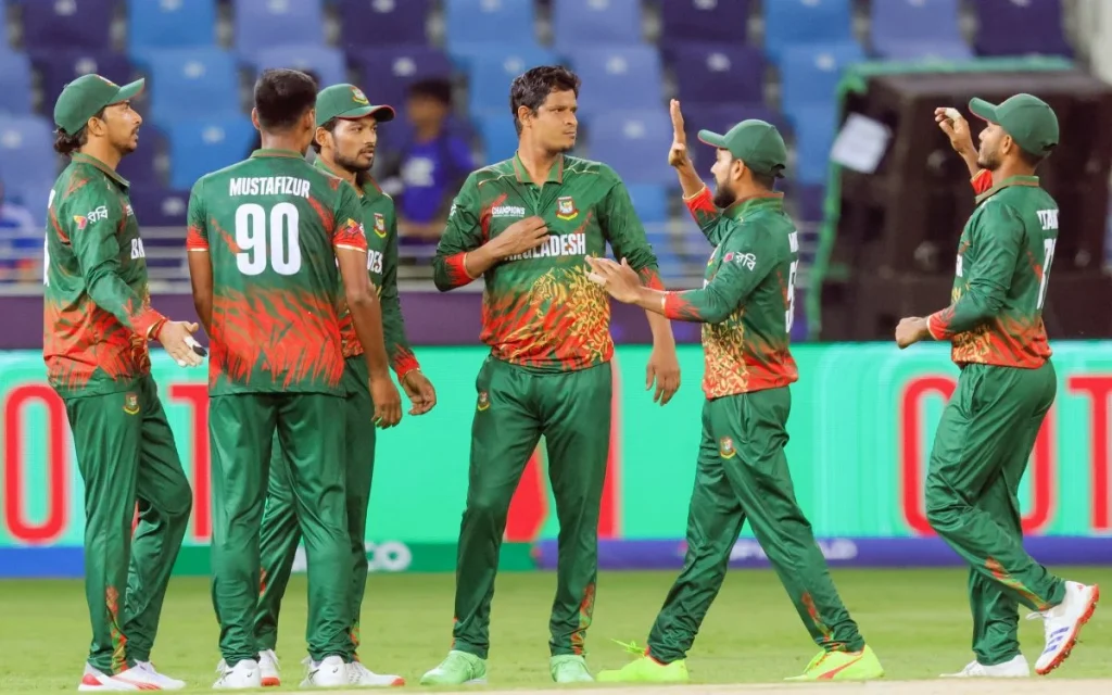 Empty stadium seats with a Bangladesh cricket team flag, representing the team's absence from the T20 World Cup