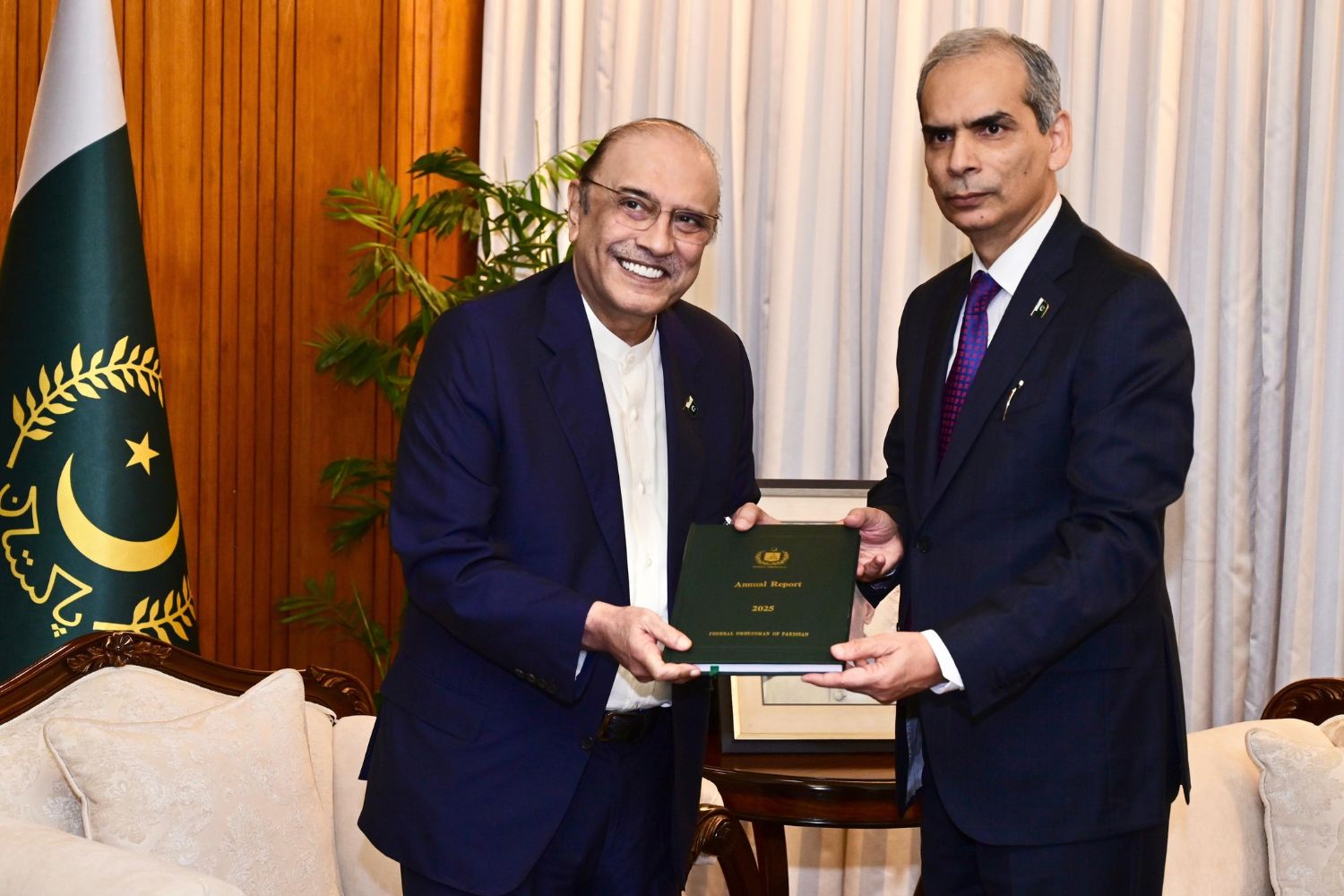 President Asif Ali Zardari receives the Wafaqi Mohtasib Annual Report for 2025 from Federal Ombudsman Naveed Kamran Baloch.