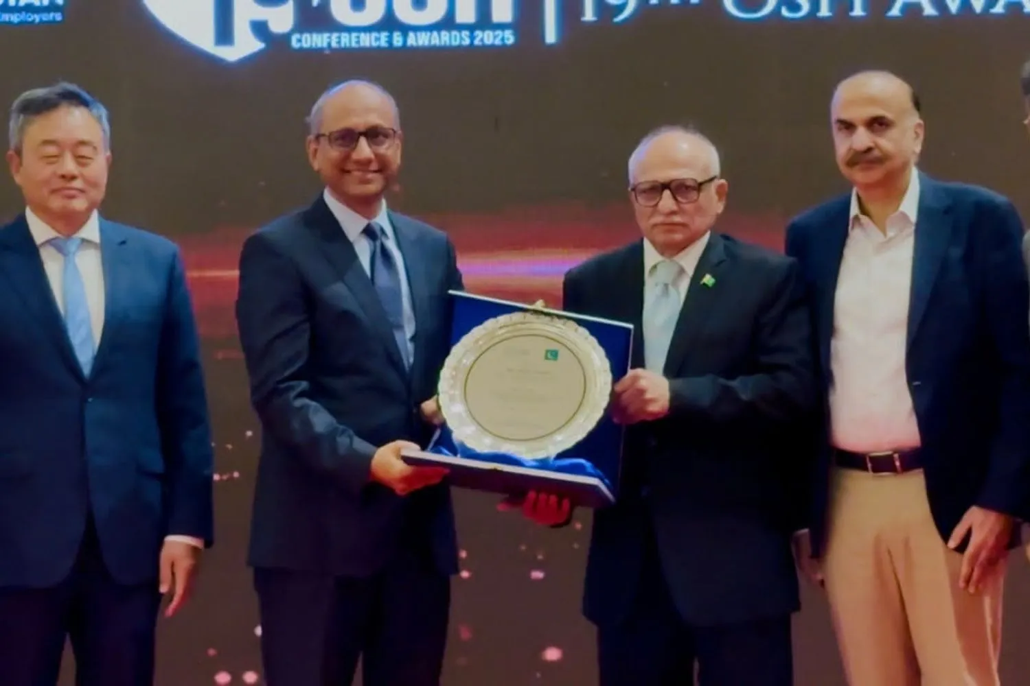 Occupational safety and health awards ceremony with business representatives and officials in Pakistan.