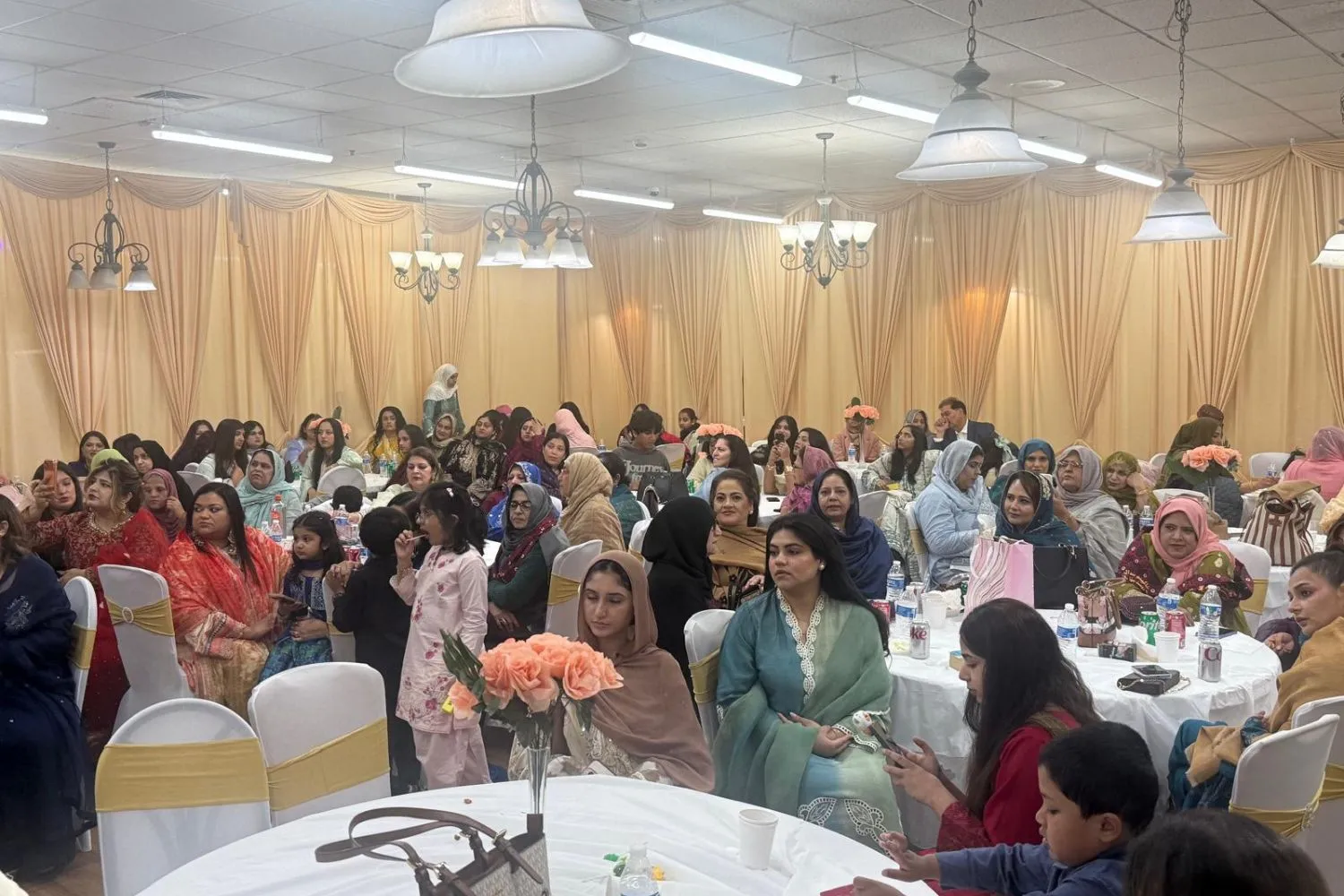 Pakistani-American families and community members gather to celebrate cultural heritage and unity at a family festival in the United States.
